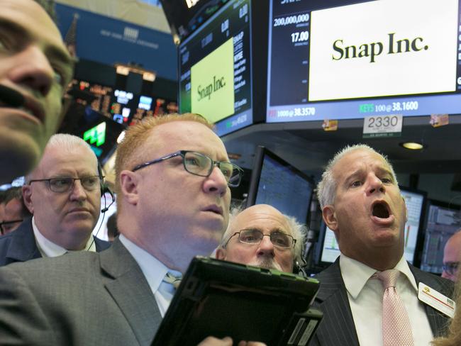 Traders follow the IPO for Snap Inc. at the New York Stock Exchange, Thursday, March 2, 2017. (AP Photo/Richard Drew)