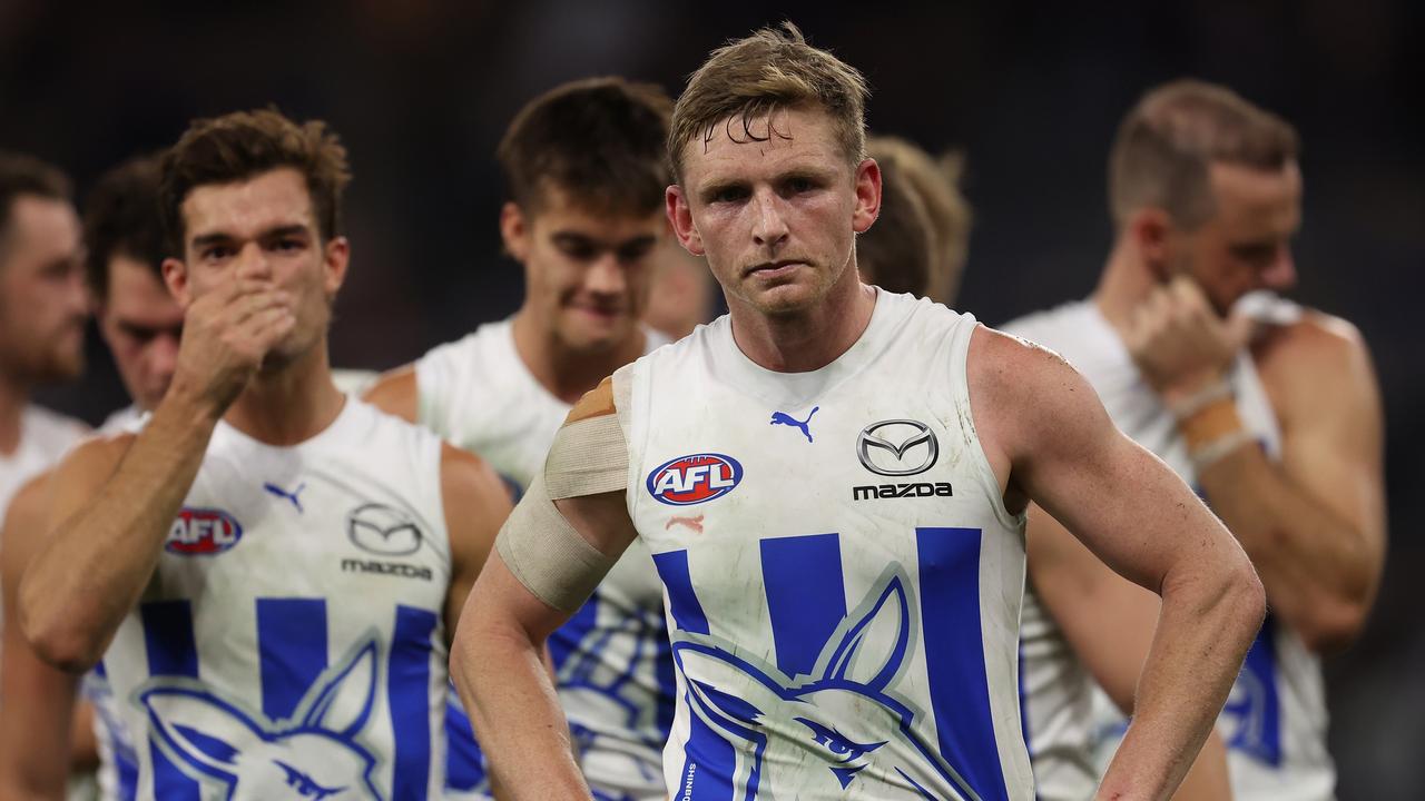 Jack Ziebell leads the Kangaroos from the field after being thrashed by Fremantle at Perth Stadium in round 8. North Melbourne sits 1-7 for the season.