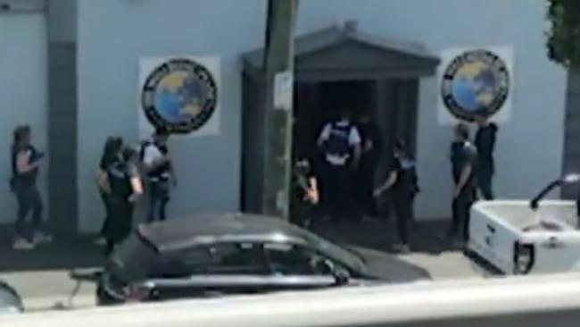 Police enter the former brothel. Picture: Seven News