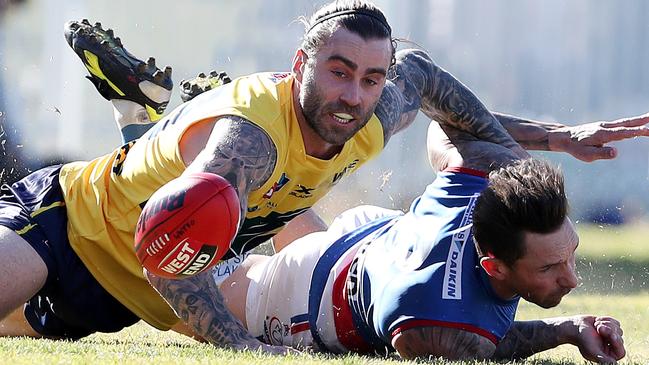 Eagle Jack Firns brings former teammate James Boyd, now with Central District, to ground during Saturday’s five-goal win at Woodville Oval. Picture: SARAH REED.