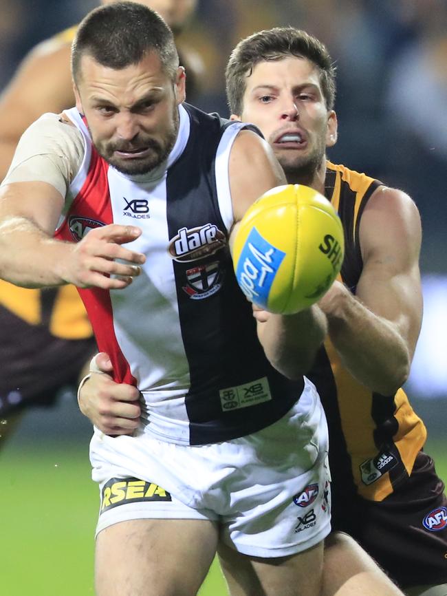 Luke Bruest brings down St Kilda captain Jarryn Geary.