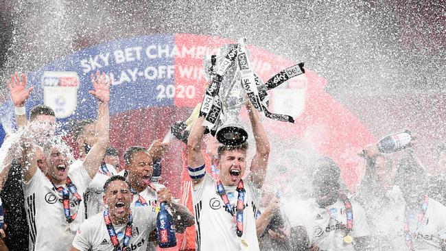 Tom Cairney of Fulham lifts the trophy as the team celebrate victory after during the Sky Bet Championship Play Off Final match between Brentford and Fulham at Wembley Stadium. Picture: Getty Images