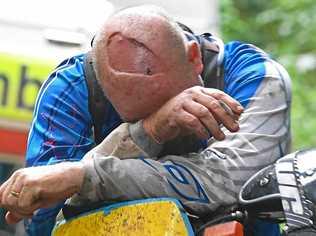 DEVASTATED: A trail-bike rider (pictured) struggles to hold back emotions after the loss of his mate at the Imbil State Forest today. Picture: Troy Jegers