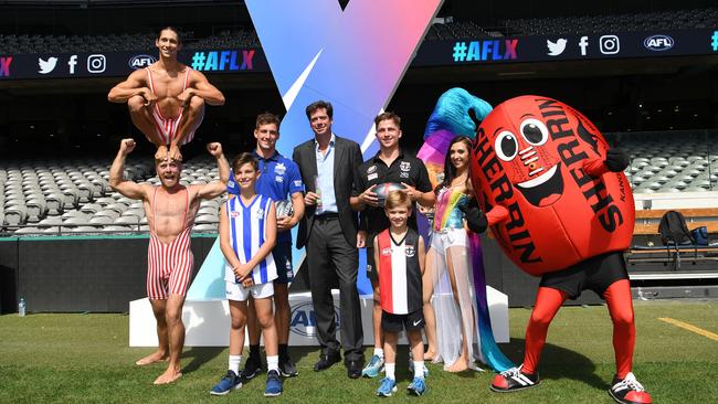 AFL chief executive Gillon McLachlan, Kangaroo Shaun Atley and Saint Jack Billings joined performers at the launch of the first AFLX season at Etihad Stadium.
