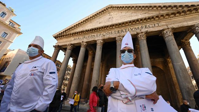 Italian chefs, wearing face masks and respecting social distance guidelines, participate in a protest at Pantheon Square in Rome yesterday. Picture: AFP