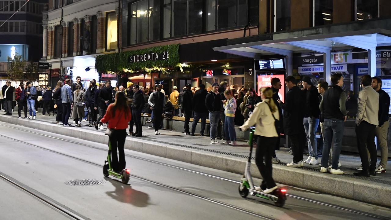 A huge crowd of people queue to get into a bar in the Norwegian capital of Oslo on Saturday after all Covid-19 restrictions were removed. Picture: AAP