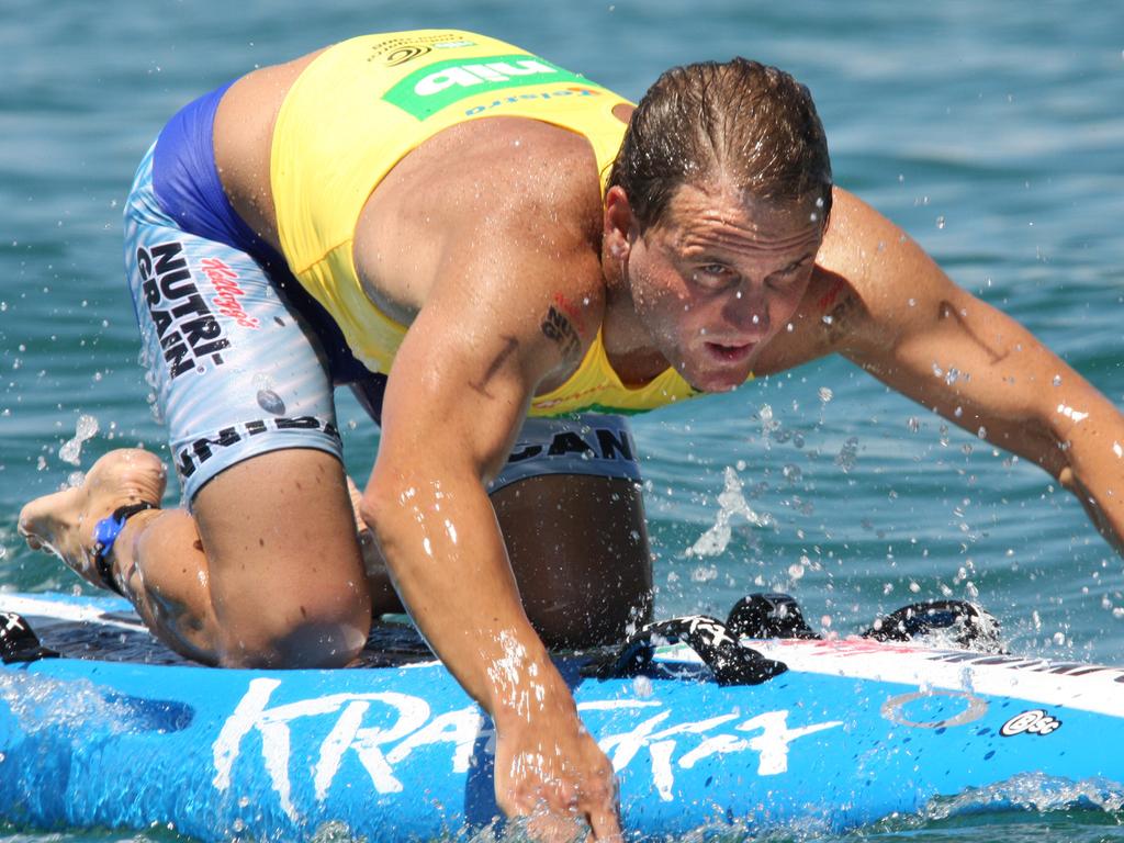 Ironman Dean Mercer competing in the Coolangatta Gold race on Gold Coast in Queensland.