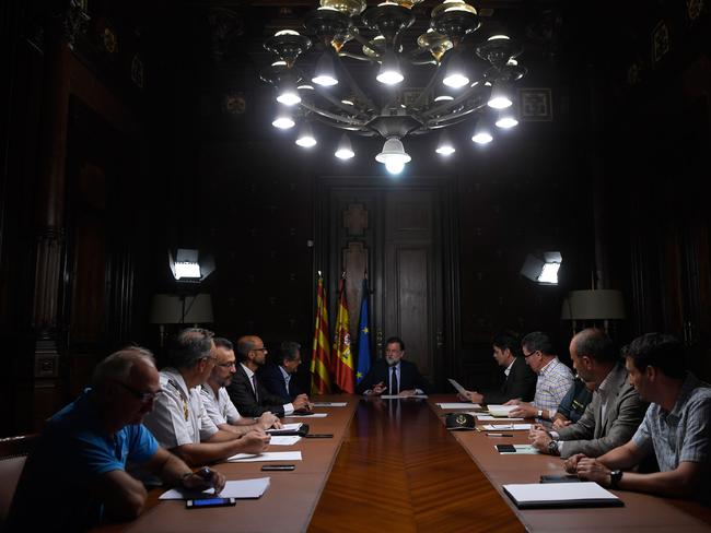 Spanish Prime Minister Mariano Rajo, centre, speaks during a meeting following the attack in Barcelona. Picture: AFP