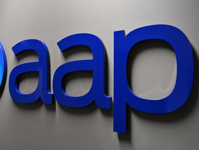 An AAP logo is seen at Sydney Bureau of national newswire Australian Associated Press in Sydney, Thursday, May 21, 2020. (AAP Image/Dean Lewins) NO ARCHIVING