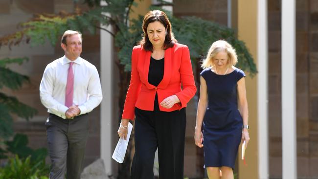 Queensland Premier Annastacia Palaszczuk, centre, says people need to use their common sense. Picture: AAP