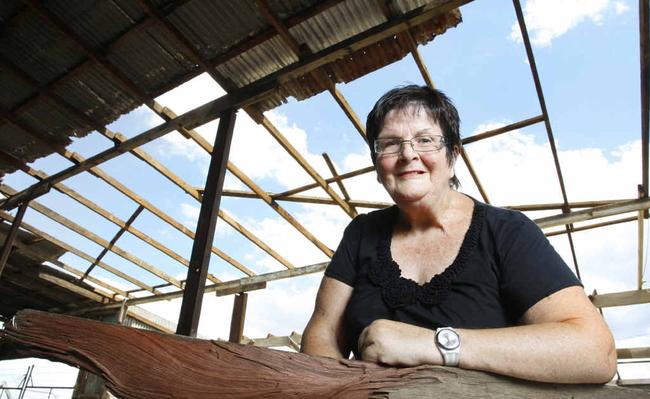 Patrick Estate resident Yvonne Hawkins with some of the wood that came off her shed during a storm. Picture: Sarah Harvey