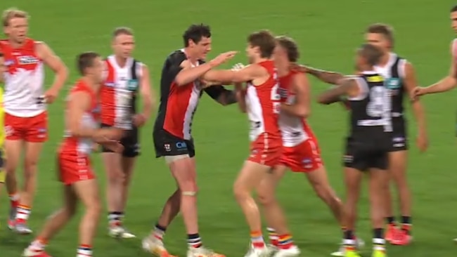 Saint Jake Carlisle targets Swan Dane Rampe's injured hand.