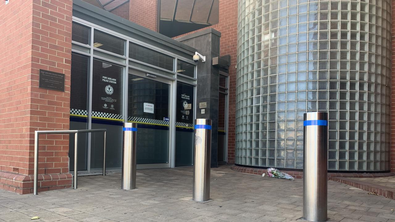 Flowers left at Port Adelaide police station after the death of a police officer on Monday. Picture: Tara Miko