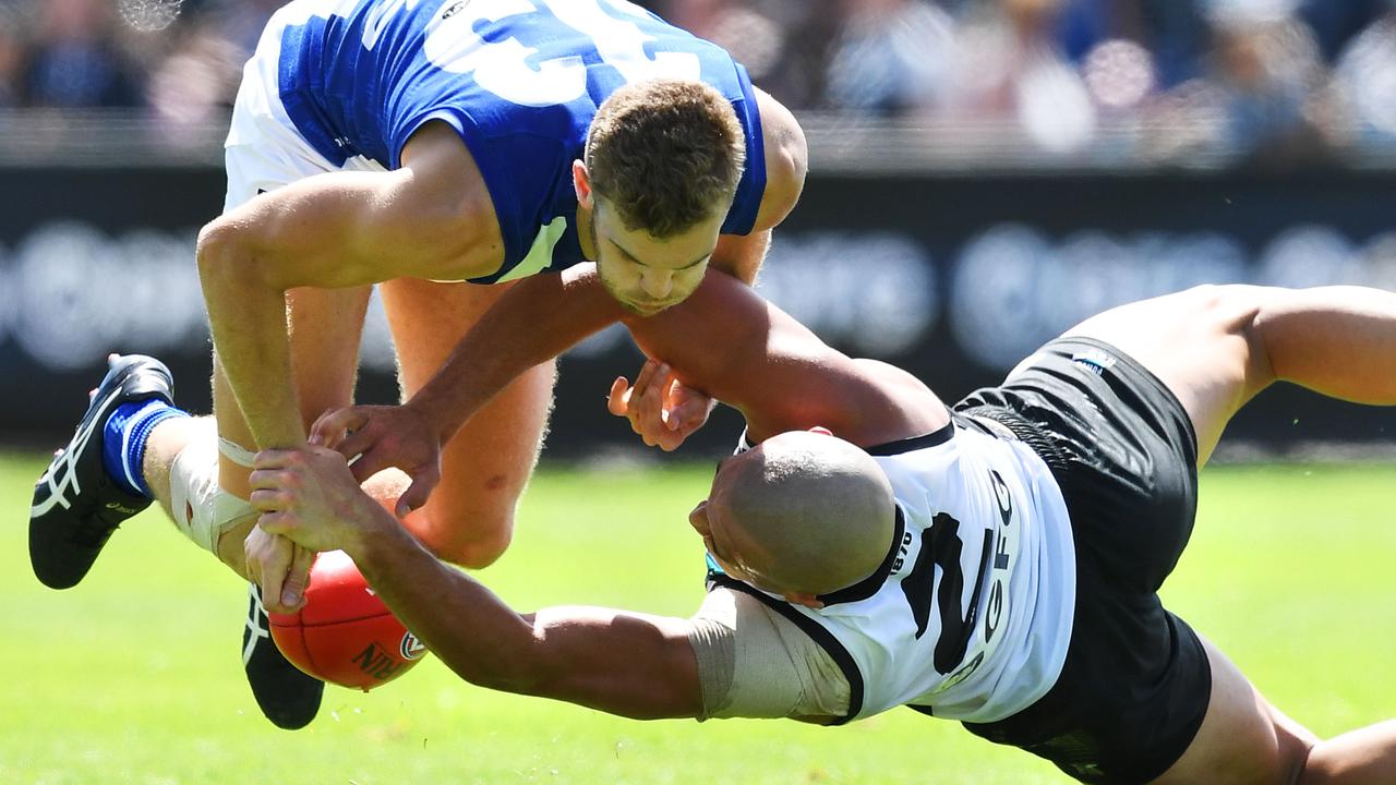 Sam Powell-Pepper and Ed Vickers-Willis attack the footy.