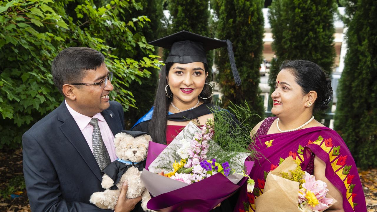 Bachelor of Nursing graduate Yupika Gautam with dad Lila Gautam and mum Kabita Gautam at the UniSQ graduation ceremony at Empire Theatres, Tuesday, December 13, 2022. Picture: Kevin Farmer