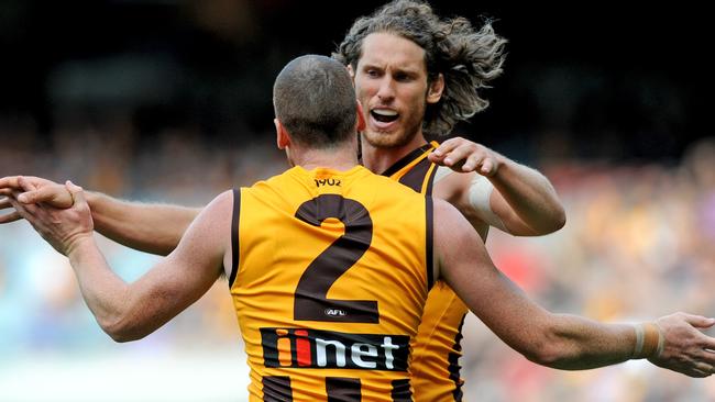 Ty Vickery celebrates an early-season goal with skipper Jarryd Roughead. Picture: AAP