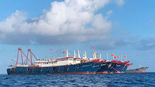 Chinese vessels anchored at Whitsun Reef, some 320km west of Palawan Island in the South China Sea. The move led to the United States on April 7 warning China against what the Philippines and Taiwan see as increasingly aggressive moves. Picture: AFP PHOTO / National Task Force-West Philippine Sea via Philippine Communications Operations Office