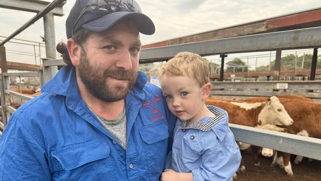 Dan Delahunty, with son Beau, 3, from Colac, were watching the market at Hamilton to get a feel for prices. With grandfather Michael Delahunty they were considering increasing their numbers.