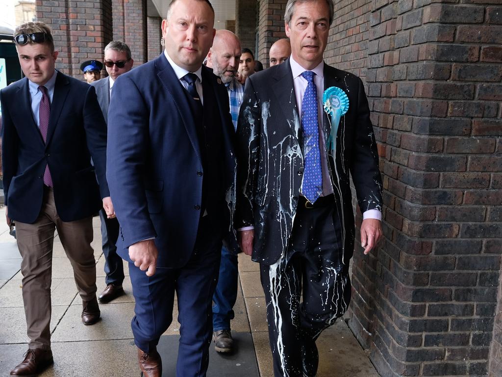Brexit Party leader Nigel Farage (right) had a milkshake thrown over him during a visit to Newcastle.