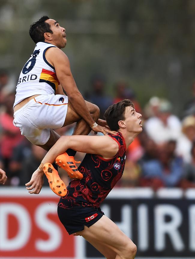 Crows star Eddie Betts flies over Jake Lever in the Round 10 clash against Melbourne at TIO Traegar Park Oval in Alice Springs. Betts has failed to reach his dazzling heights this season. Picture: AAP Image/Mark Brake