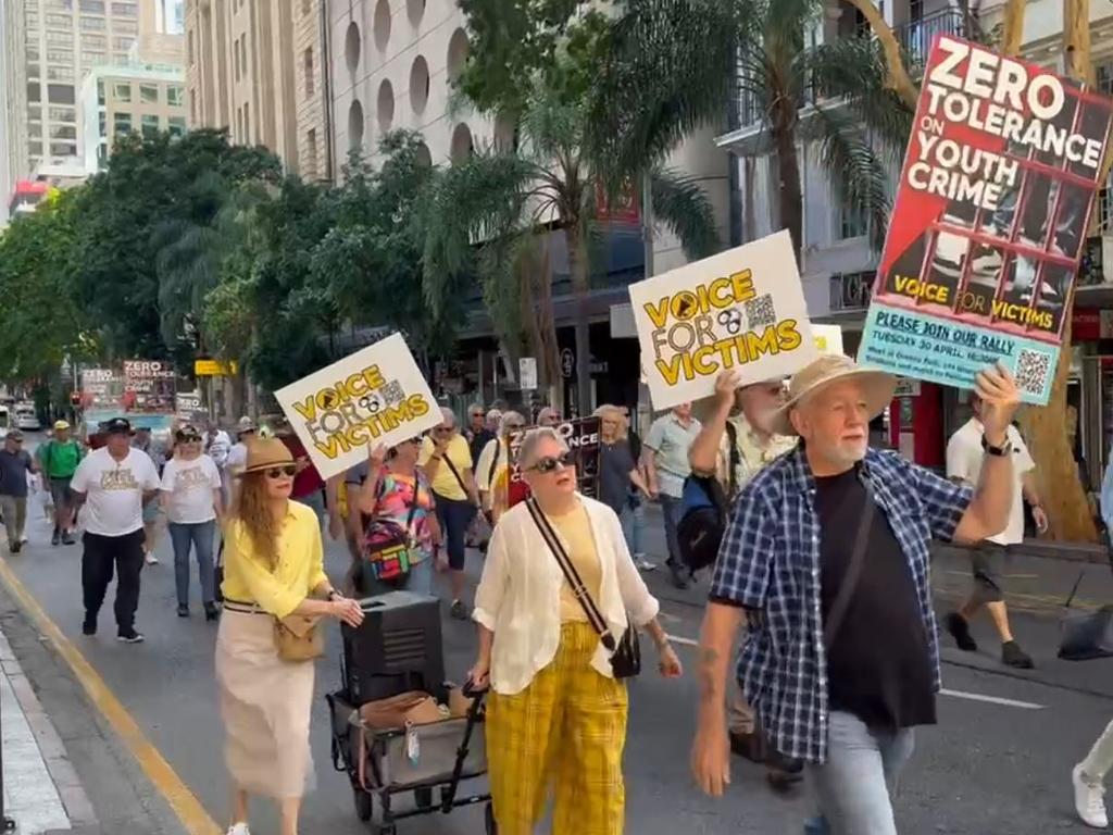 People march in the Voice for Victims rally on Tuesday.