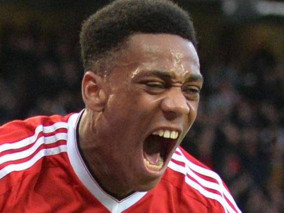 Manchester United's French striker Anthony Martial celebrates after scoring their first goal during the English FA Cup quarter final football match between Manchester United and West Ham United at Old Trafford in Manchester, north west England, on March 13, 2016. The game finished 1-1. / AFP PHOTO / PAUL ELLIS / RESTRICTED TO EDITORIAL USE. No use with unauthorized audio, video, data, fixture lists, club/league logos or 'live' services. Online in-match use limited to 75 images, no video emulation. No use in betting, games or single club/league/player publications. /