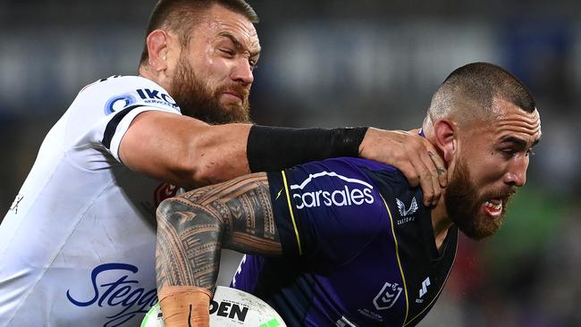 MELBOURNE, AUSTRALIA - AUGUST 26:  Nelson Asofa-Solomona of the Storm is tackled by Jared Waerea-Hargreaves of the Roosters  during the round 24 NRL match between the Melbourne Storm and the Sydney Roosters at AAMI Park on August 26, 2022, in Melbourne, Australia. (Photo by Quinn Rooney/Getty Images)