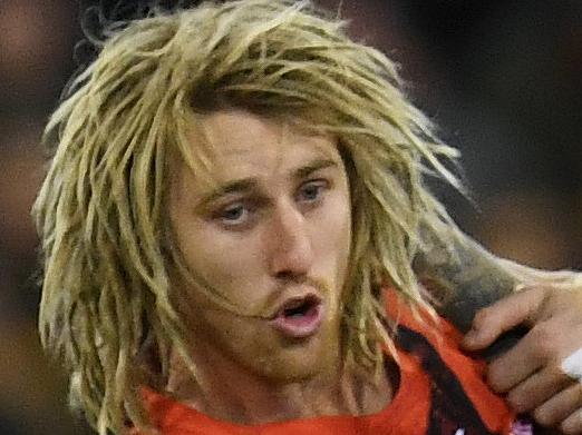 Dyson Heppell of the Bombers (left) and Dustin Martin of the Tigers contest during the Round 10 AFL match between the Richmond Tigers and the Essendon Bombers at the MCG in Melbourne, Saturday, May 27, 2017. (AAP Image/Julian Smith) NO ARCHIVING, EDITORIAL USE ONLY