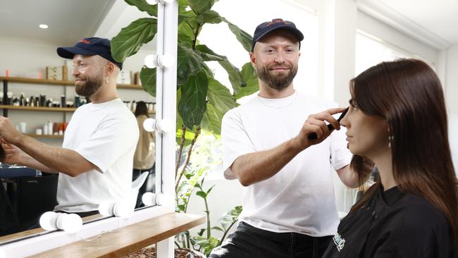 Edwards and Co hair stylist Craig Walker with his client Mirren Gilbert. Picture: Richard Dobson/The Daily Telegraph.