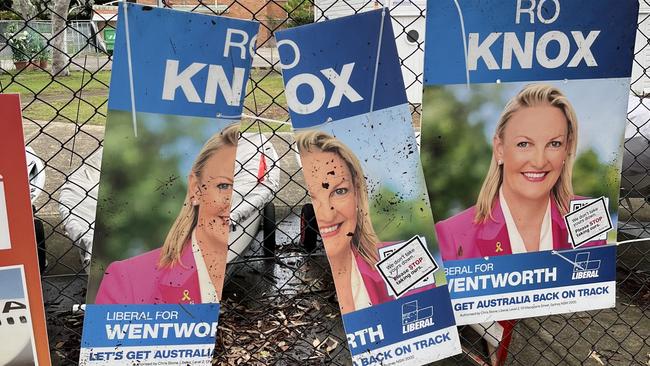 The slashed posters at Rose Bay, behind the pre poll station.