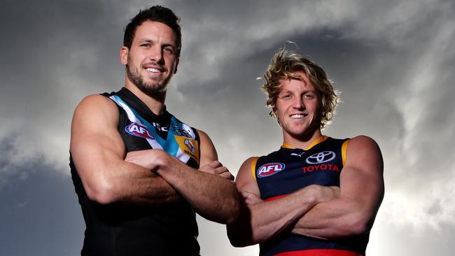 Former Power captain Travis Boak and Crows captain Rory Sloane both knocked back big offers to return home to stay in Adelaide. Picture: Sarah Reed