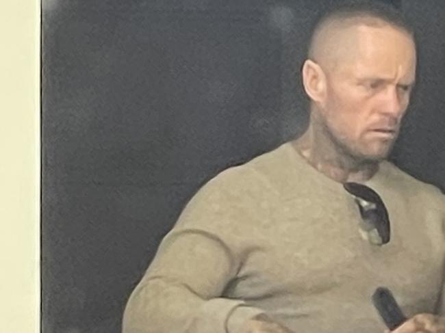 Bandidos outlaw motorcycle gang member Joshua Hugh Deane (left) leaving Wyong Local Court with a woman after having his bail varied. Picture: NewsLocal