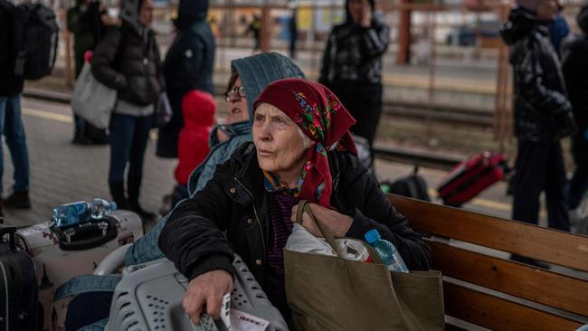 A Ukrainian evacuee waits to board a train en route to Warsaw at the rail station in Przemysl, near the Polish-Ukrainian border. Picture: Angelos Tzortzinis / AFP