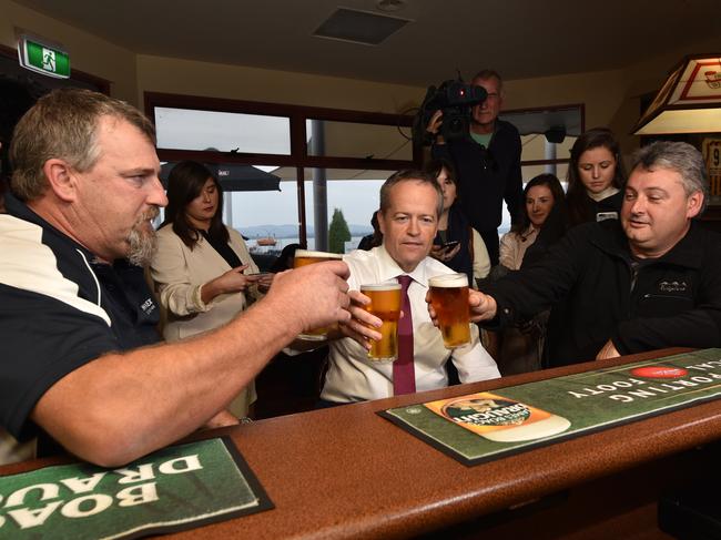 Australian Opposition Leader Bill Shorten speaks with Beaconsfield Mine survivors Todd Russell and Brant Webb at the Waterfront Hotel during a visit to Beauty Point, Tasmania, Sunday, May 8, 2016. (AAP Image/Scott Gelston) NO ARCHIVING