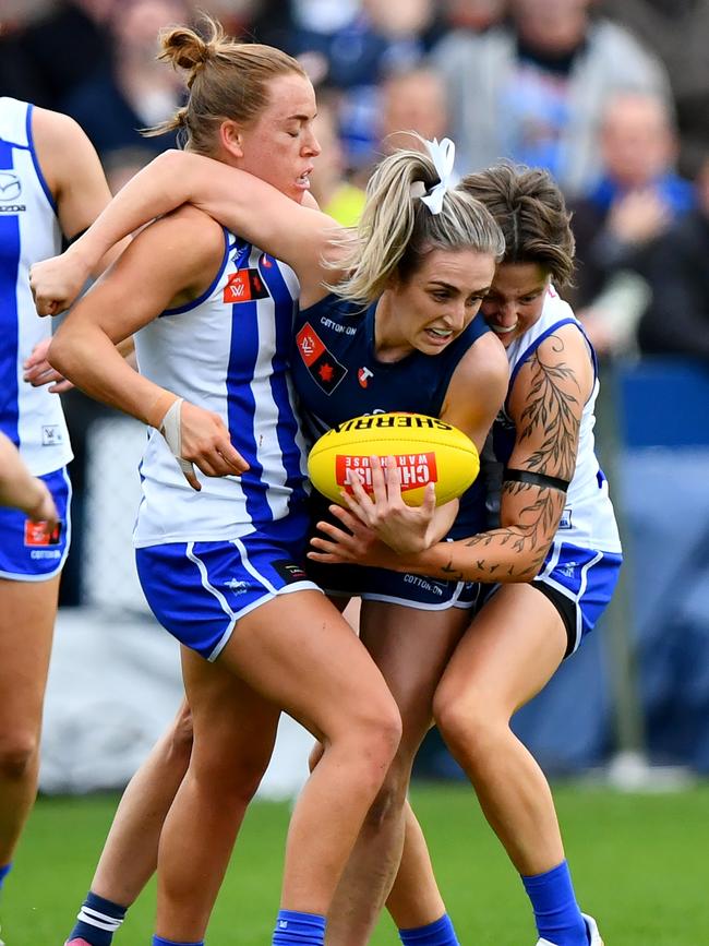 Geelong’s Amy McDonald fights to dispose of the ball under pressure on Sunday. Picture: Josh Chadwick/AFL Photos/via Getty Images