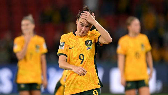 A dejected Caitlin Foord reflects on Australia’s loss to Nigeria. Picture: Bradley Kanaris/Getty Images