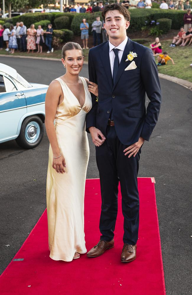 Graduates Charli Botham and Charlie Crawford arrive at Mary MacKillop Catholic College formal at Highfields Cultural Centre, Thursday, November 14, 2024. Picture: Kevin Farmer