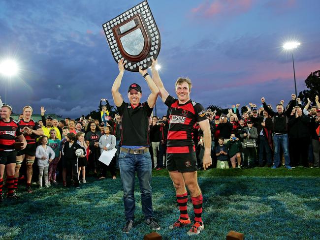 Coach Simon Cron and Will Miller hoist the Shute Shield.