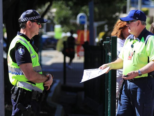 August 9, 10.35am, Griffith Street Coolangatta, Pedestrian foot traffic is stopped and checked for border passes as Queensland steps up its tightened security with Covid restrictions.Scott Powick Newscorp