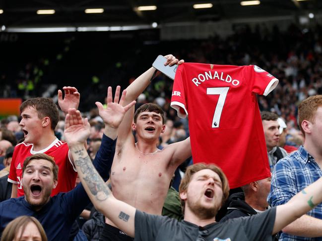 Manchester United fans at their raucous best at a recent match. Picture: AFP