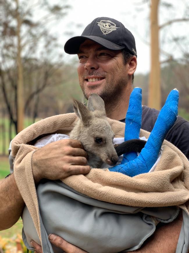 Craig de Meillon helps rebuild Wild2Free kangaroo sanctuary after it was destroyed by bushfires.