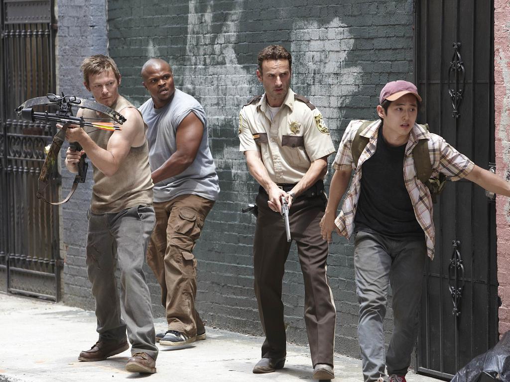 Rick Grimes (in his cop gear) and fellow survivors back in the early days.