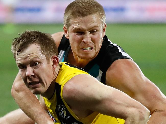 ADELAIDE, AUSTRALIA - JULY 01: Jack Riewoldt of the Tigers and Tom Clurey of the Power in action during the 2017 AFL round 15 match between the Port Adelaide Power and the Richmond Tigers at Adelaide Oval on July 01, 2017 in Adelaide, Australia. (Photo by Michael Willson/AFL Media/Getty Images)