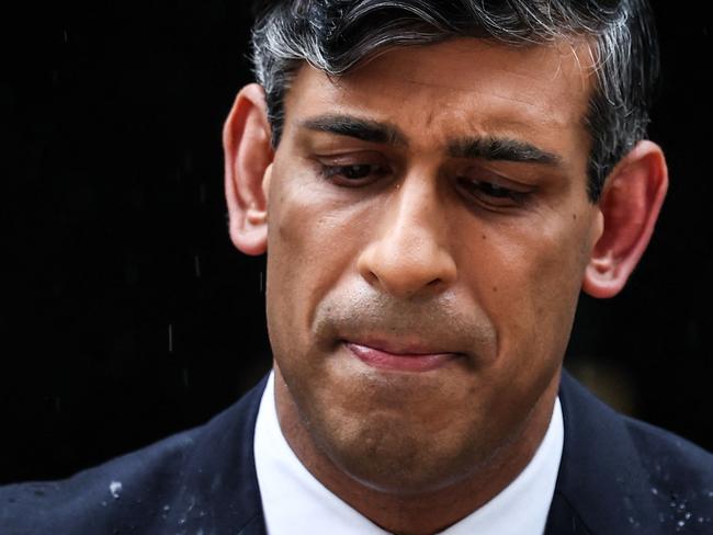 Rishi Sunak’s announces the election on May 22. The rain was considered a portent of a horror campaign for the Conservatives. Picture: Henry Nicholls/AFP