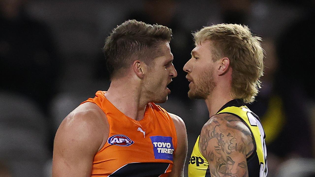 Jesse Hogan, pictured going head to head with Tiger Nathan Broad last year, will play his 100th match on Sunday. Picture: Michael Klein