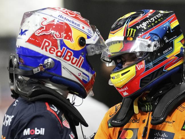 Red Bull driver Max Verstappen of the Netherlands, pole position, left, cheers with McLaren driver Oscar Piastri of Australia, second fastest time, after the qualifying session ahead of the Formula One Saudi Arabian Grand Prix at the Jeddah Corniche Circuit in Jeddah, Saudi Arabia, Saturday, April 19, 2025. (AP Photo/Darko Bandic)