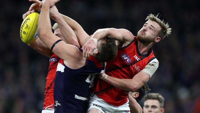 Essendon’s Martin Gleeson spoils Fremantle’s Sean Darcy. Picture: AAP