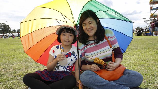 Elaine Heng and daughter Eleanor, 9, enjoy the sunshine on Saturday.