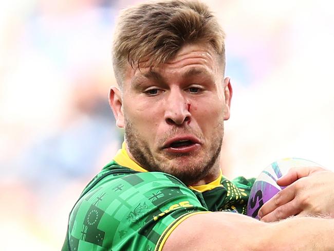 Jai Arrow of Australia is tackled by the PNG defence in the Men's Pool game between Australia and PNG during the Downer Rugby League World Cup 9's competition at Bankwest Stadium in Sydney,  Saturday, October 19, 2019.  (AAP Image/Brendon Thorne) NO ARCHIVING, EDITORIAL USE ONLY