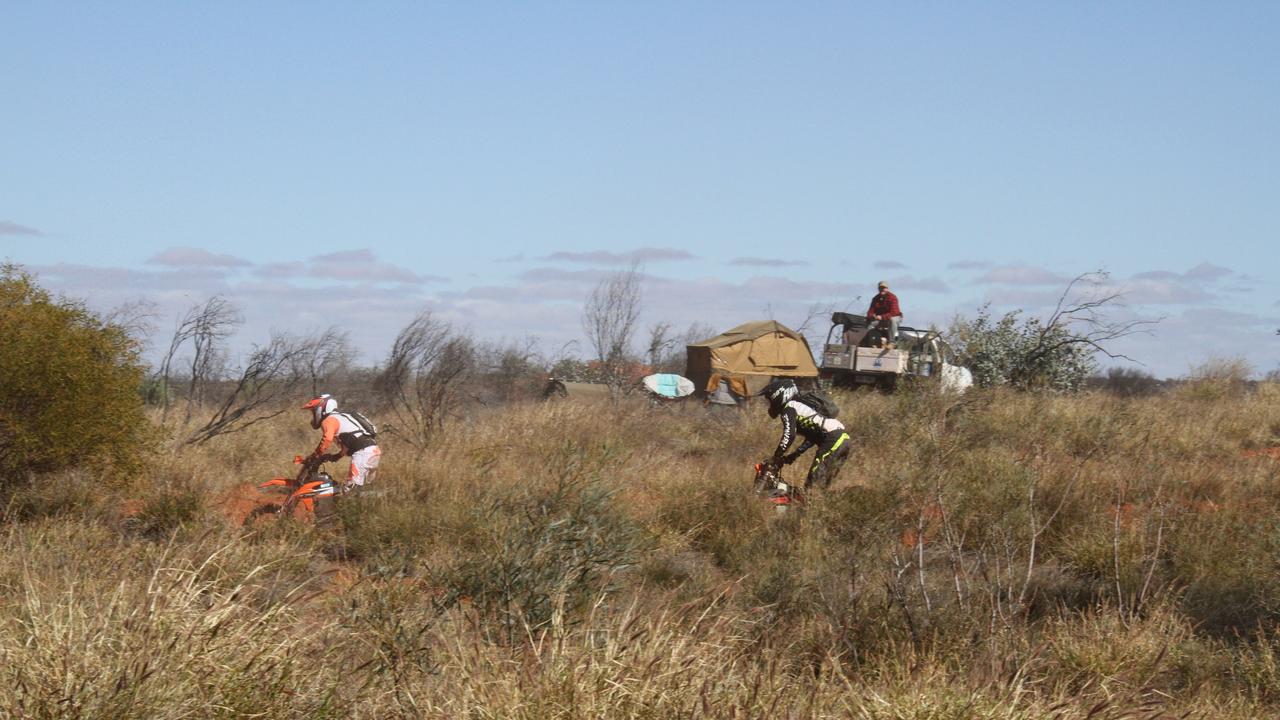 The 2025 Finke Desert Race has begun, with hundreds of punters lining the track south of Alice Springs to catch the action. Picture: Gera Kazakov